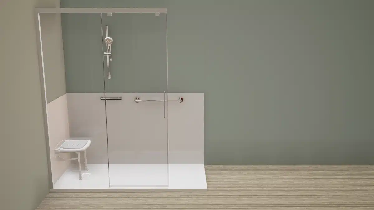 Accessible glass-enclosed shower with a handheld showerhead, two chrome grab bars, and a wall-mounted built-in seat inside a low-threshold stall.